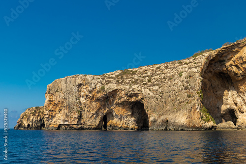 The Blue Grotto is a complex of sea caves along the Southeastern part of Malta, and on sunny days, the reflection of sunlight on the white sandy seafloor lights up the caves in bright blue hues