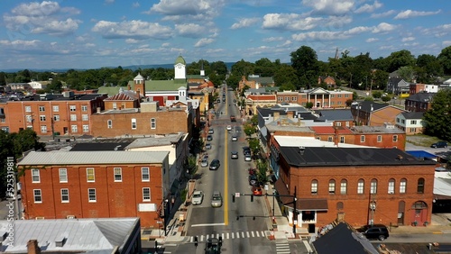 Fototapeta Naklejka Na Ścianę i Meble -  Low aerial view of main street usa, Charles Town, West Virginia, WV on a beautiful sunny day.