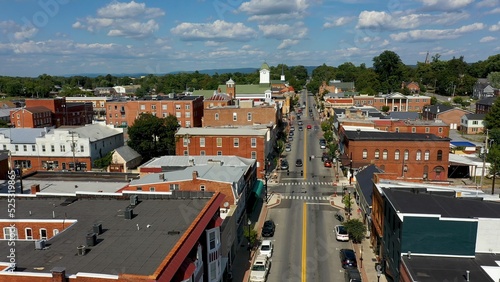 Fototapeta Naklejka Na Ścianę i Meble -  Low aerial view of main street usa, Charles Town, West Virginia, WV on a beautiful sunny day.
