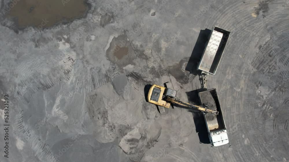 excavator scooping rocks, stone construction
excavator scooping rocks, stone construction