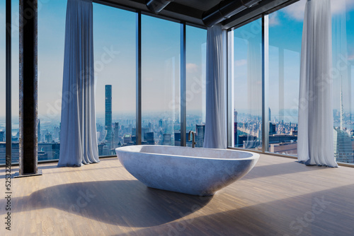 Valokuva freestanding granite bathtub in large empty loft apartment; luxury interior with