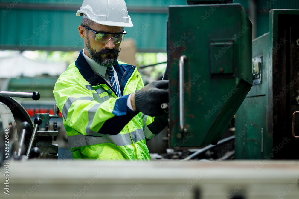 Engineer working at industrial machinery in factory. Manual workers cooperating while measuring a electronic. Engineer working at industrial machinery in factory. Manual workers cooperating while measuring a electronic.