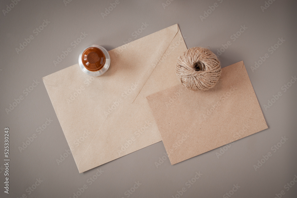 Envelopes, a rope and an ex-libris are fixed on a leather substrate. Flatlay. Envelopes, a rope and an ex-libris are fixed on a leather substrate. Flatlay.