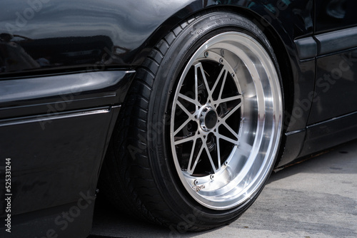 Alloy car wheel rim with break and new tire close up view 