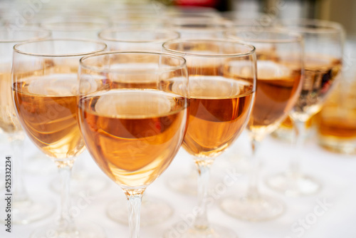 close-up of a lot of glasses of rose wine