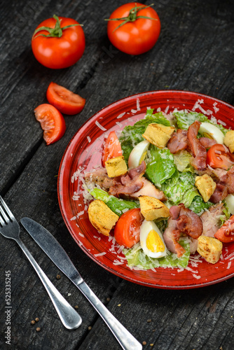 fresh salad with meat, bacon and tomatoes 