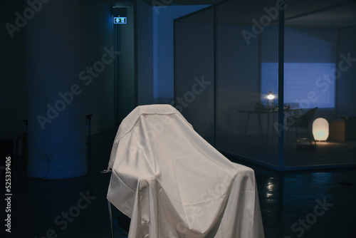 White chair covers in blue light © Thotsapon