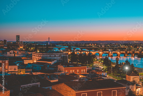 Beautiful sunset in the city of Badajoz, golden hour orange sky at dusk in a city.