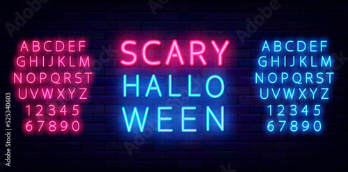 Scary halloween neon label on brick wall. Season holiday emblem. Shiny blue and pinl alphabet. Vector illustration