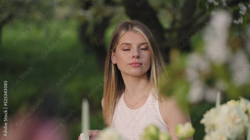 beautiful blonde woman in garden party, portrait of lady at table in nature, shy and calm female guest beautiful blonde woman in garden party, portrait of lady at table in nature, shy and calm female guest