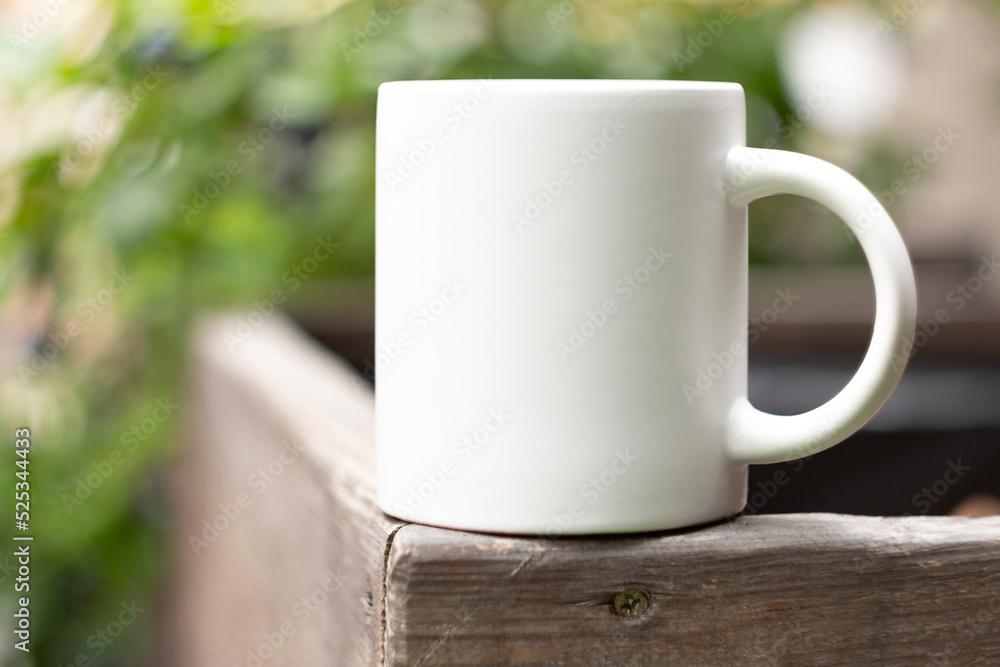 White mug in the garden.