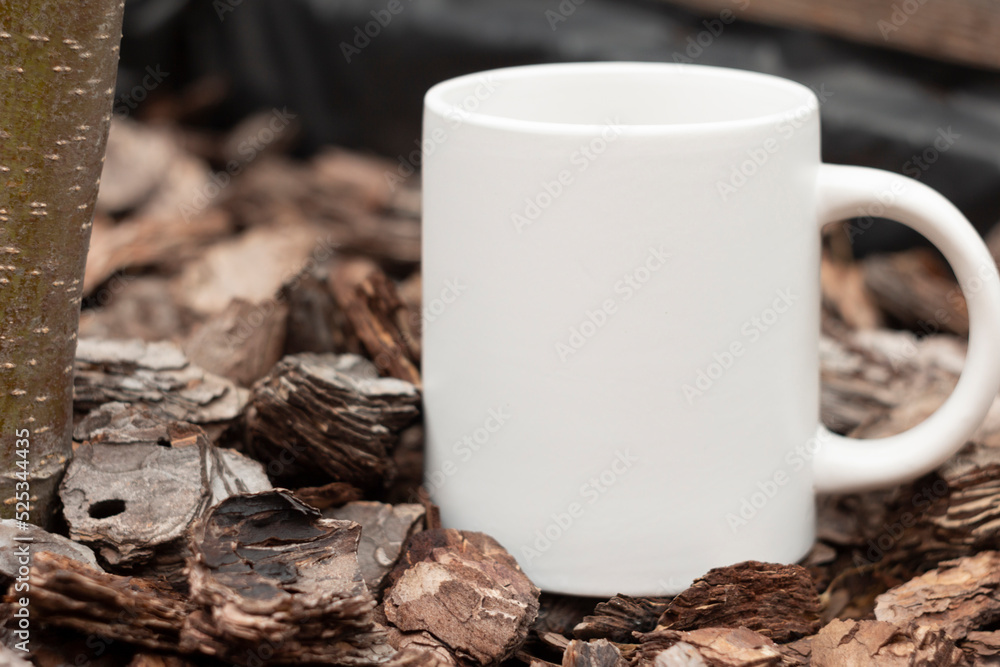 White mug in the garden.