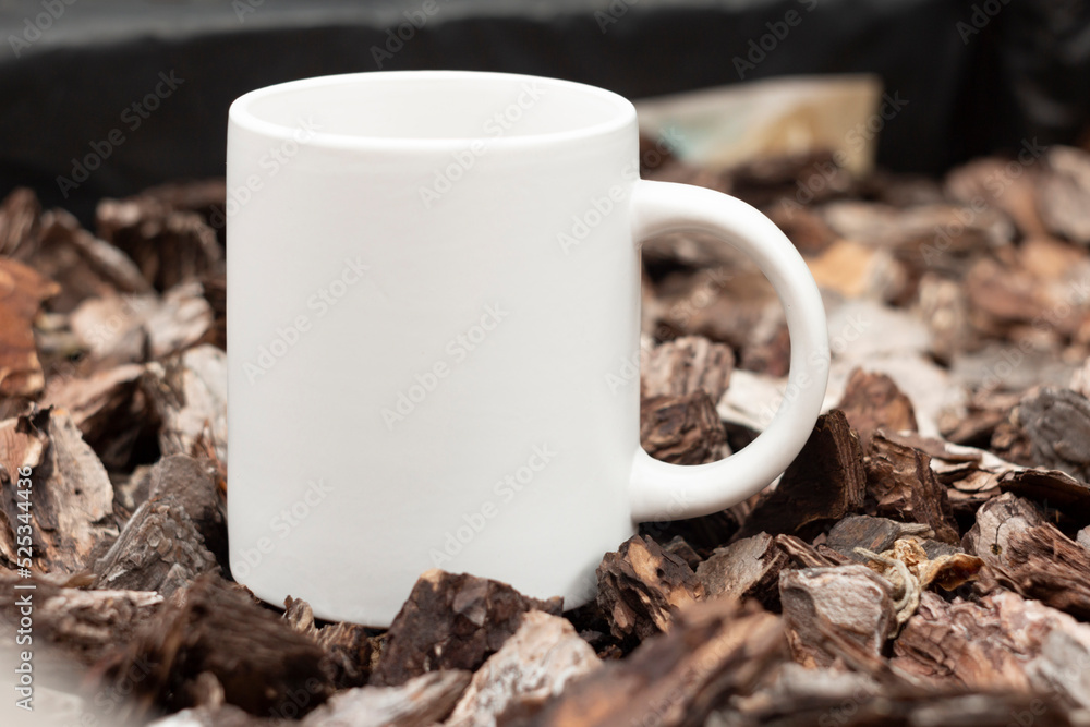 White mug in the garden.
