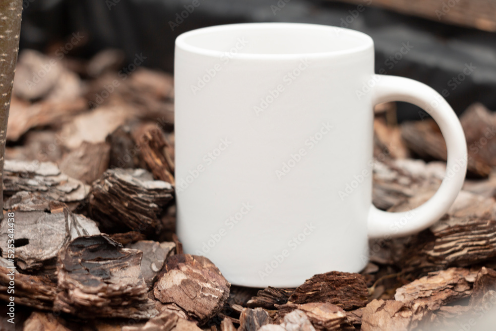 White mug in the garden.
