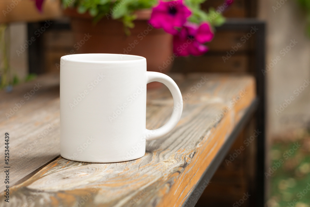 White mug in the garden.