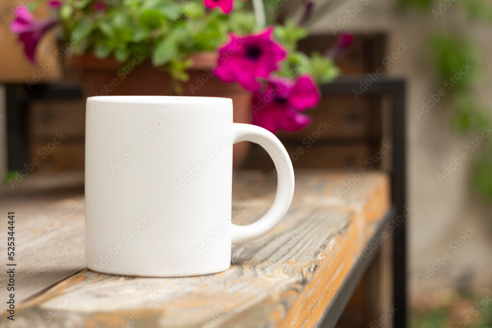 White mug in the garden.