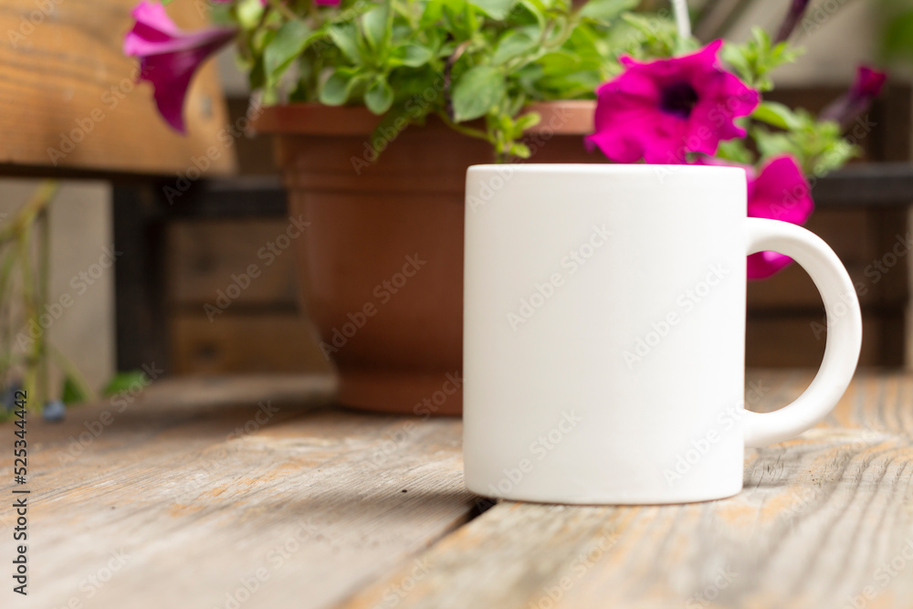 White mug in the garden.