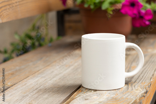 White mug in the garden.