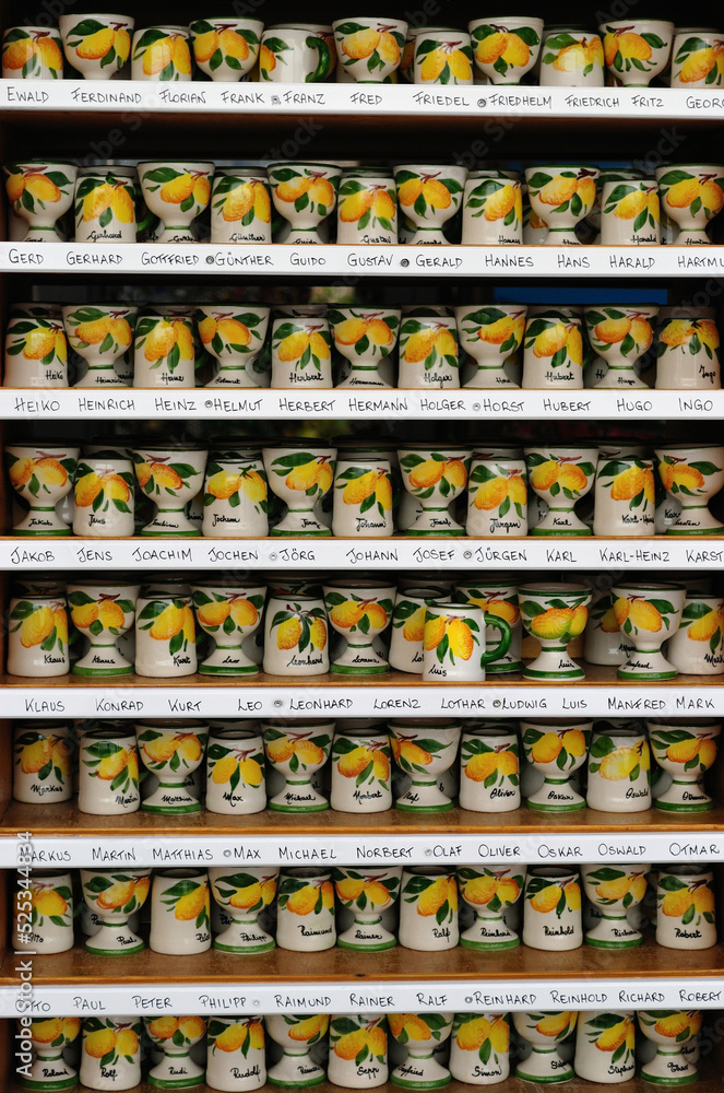 Colourful Ceramic Cups on Display Shelves  in Store 