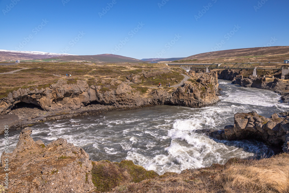 Godafoss waterfall, Iceland. Beautiful daily exposure done during the summer, of this famous landmark in Iceland. One of the most looking after travel destination in Iceland. Godafoss waterfall, Iceland. Beautiful daily exposure done during the summer, of this famous landmark in Iceland. One of the most looking after travel destination in Iceland.