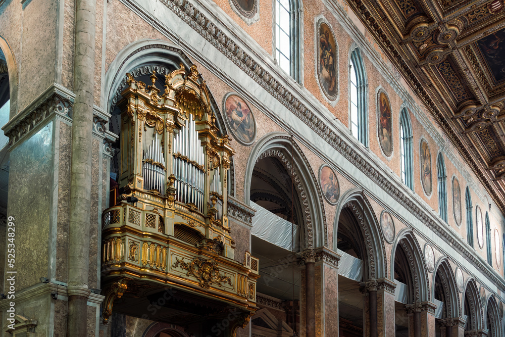 Church pipe organ and decorations inside Duomo di Napoli the Roman Catholic Cathedral of the Assumption of Mary in Campania region Naples, Italy.