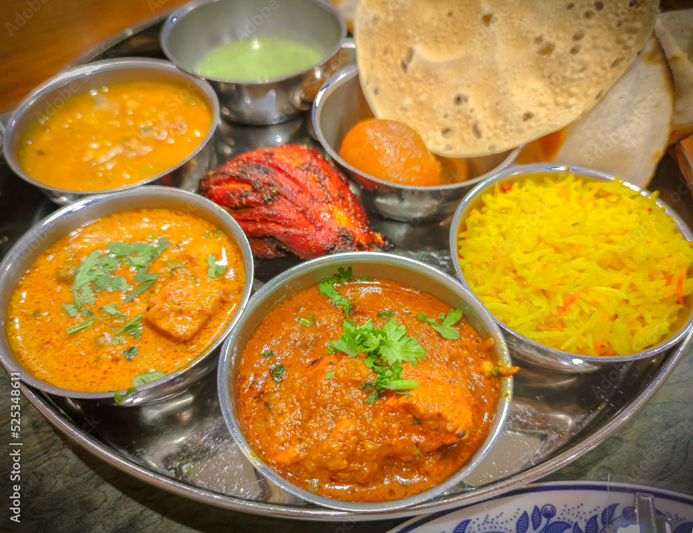 Traditional indian cuisine. Assorted indian food on table in Restaurant