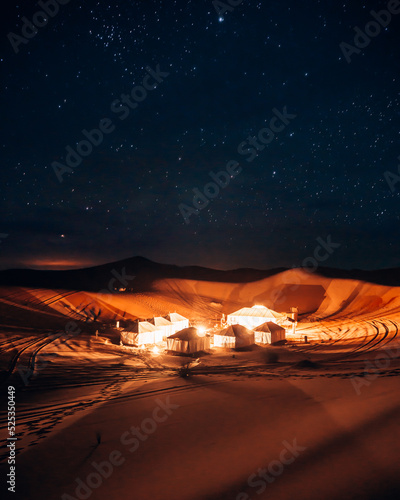 a beautiful and luxury desert camp in the erg chebli Sahara Desert in Morocco, Africa at night photo