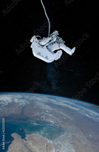 Space suits isolated on space background. Elements of this image furnished by NASA.