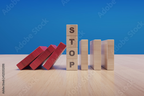 Stop text made with wooden blocks on a table photo