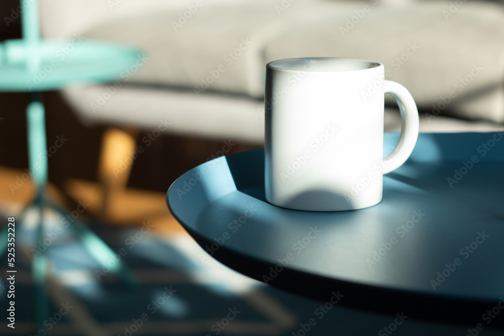 White mug on the table.