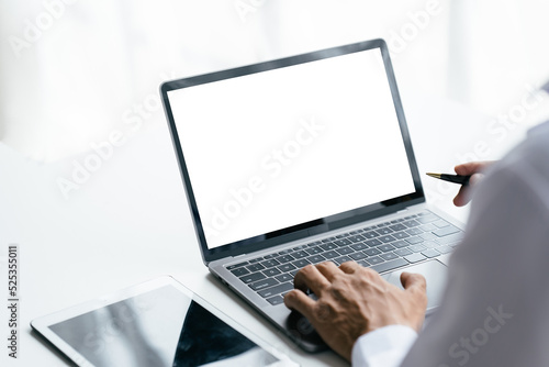 Young women working on her laptop with blank copy space screen for your advertising text message in office, Back view of business women hands busy using laptop at office desk.