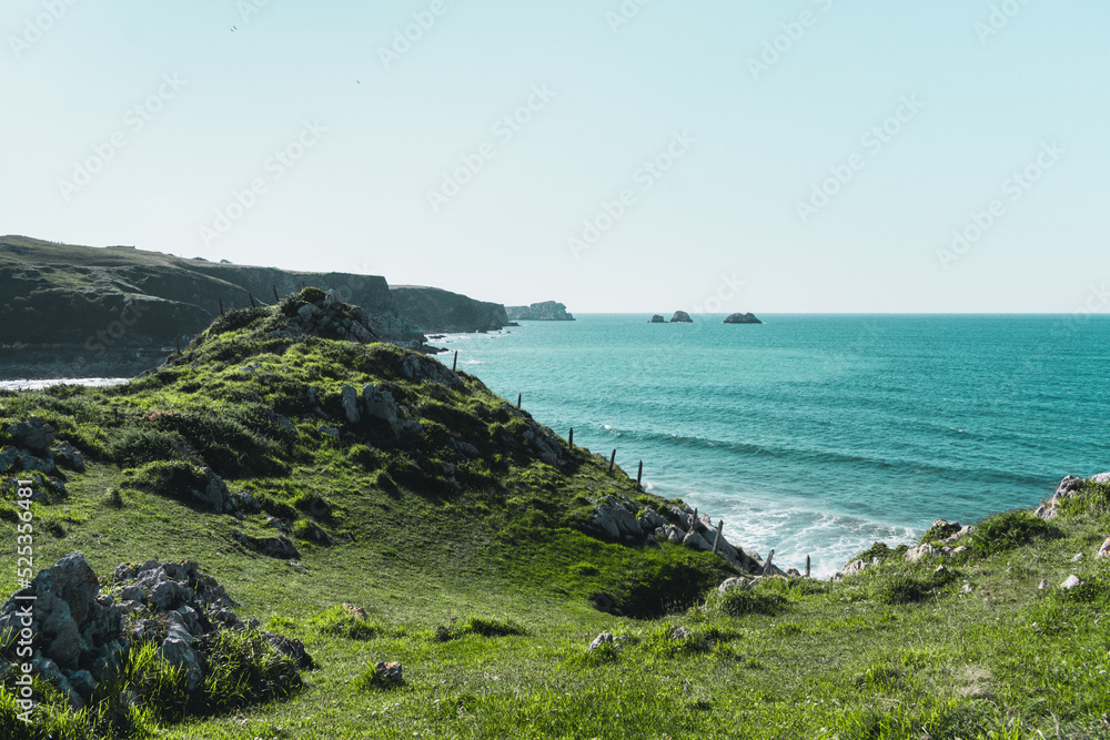 Panorama of the coastline of Usgo beach, in the north o Spain in Cantabria Panorama of the coastline of Usgo beach, in the north o Spain in Cantabria
