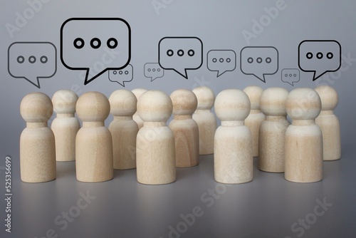 People figures with speech bubble. Social communication. Information exchange. Rumors and gossip. Talk and chat. Discussion and dialogue concept. photo