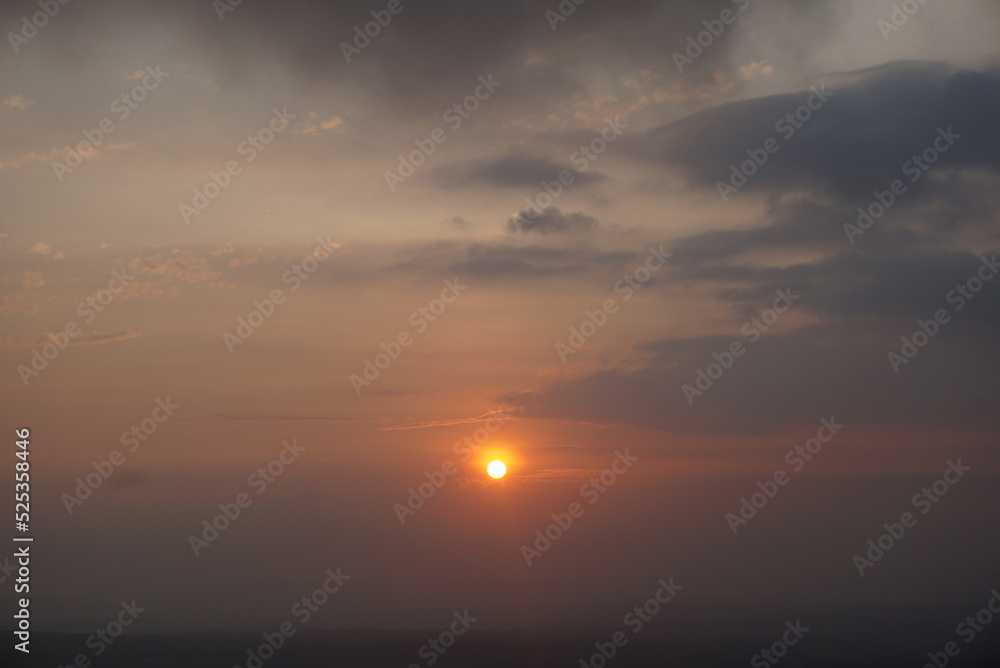 Sunrise over the hill. There are some clouds Sunrise over the hill. There are some clouds