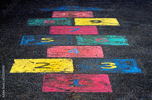 Hopscotch game painted on asphalt street