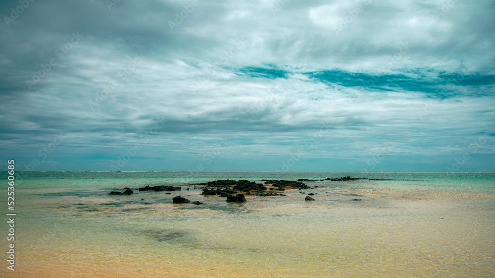beach by the sea with black stones