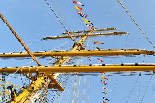 Sailboat masts decorated with flags.