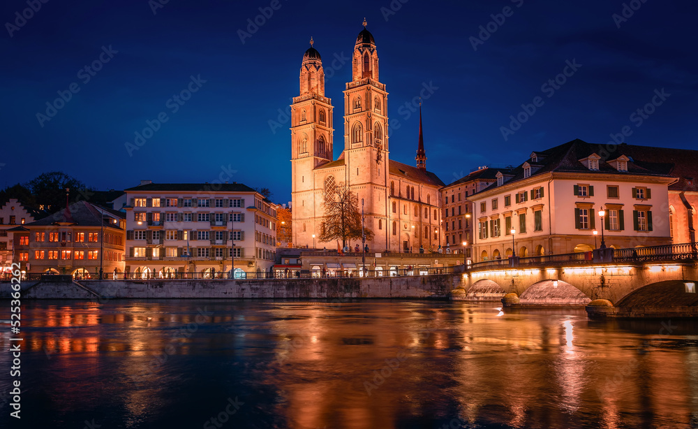 Panorama  image of evening Zurich. Night long exposure image of the Grossmunster Romanesque-style Protestant church in Zurich, Switzerland. Popular travel dectination.