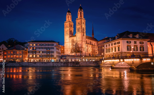 Panorama  image of evening Zurich. Night long exposure image of the Grossmunster Romanesque-style Protestant church in Zurich  Switzerland. Popular travel dectination.