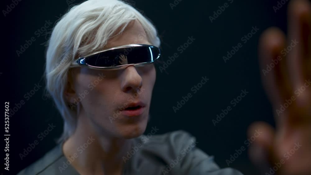Addicted gamer examining virtual reality world. Metaverse technology concept Addicted gamer examining virtual reality world. Metaverse technology concept