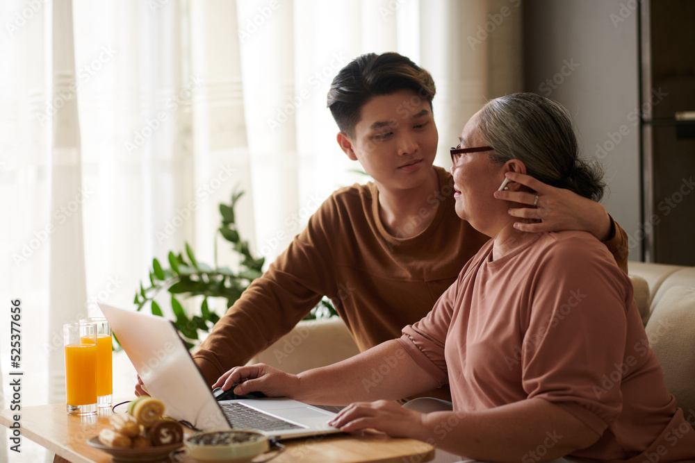 Caring Grandson Helping Grandmother Caring Grandson Helping Grandmother