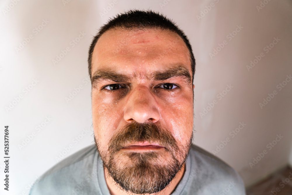 Obraz premium High angle view of bearded man with sweaty face.