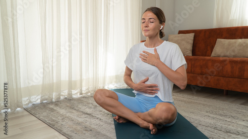 Canvas Print Breathing practice from yoga - a woman breathes and meditates