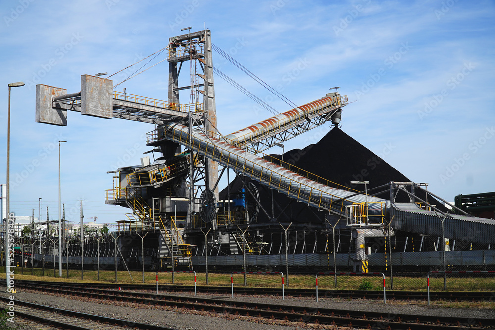 Large coal dump at coal-fired power plant in Hannover, Lower Saxony, Germany. An old technology that is partly responsible for global warming.