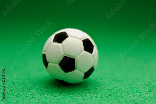 miniature soccer ball on green  design element