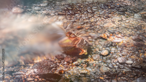 small river stone water flows