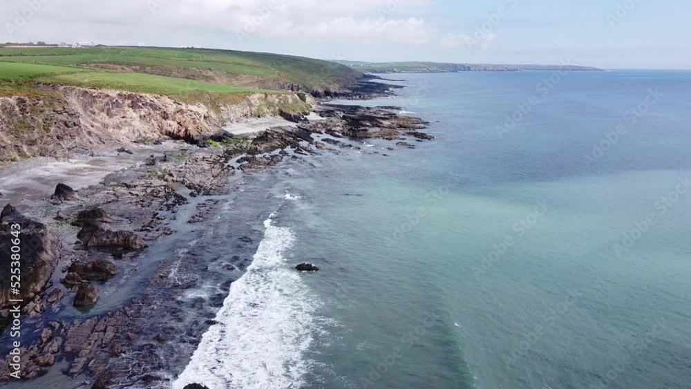 Green grass covered hills on the coast of Ireland. Rocks on the Atlantic Ocean. A picturesque seascape. Beautiful nature. Green grass covered hills on the coast of Ireland. Rocks on the Atlantic Ocean. A picturesque seascape. Beautiful nature.