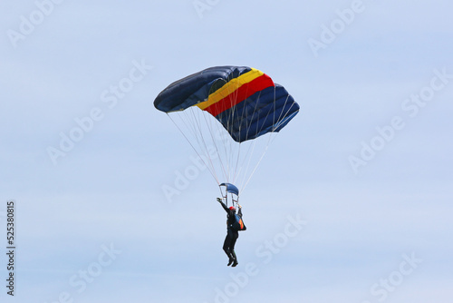  Skydiver flying wing in a blue sky 