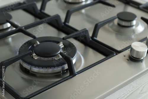 modern gas stove with gas on. close-up with space for text