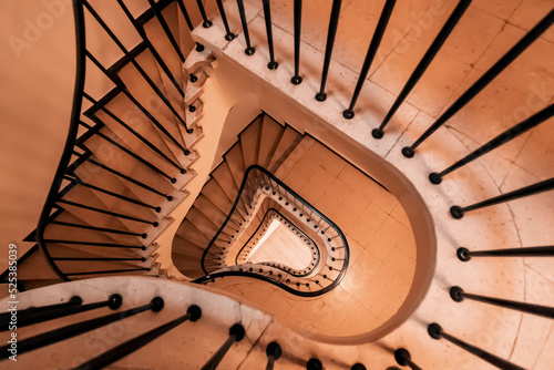 Geometric spiral pattern extending down the architectural elements of the stairs in the house